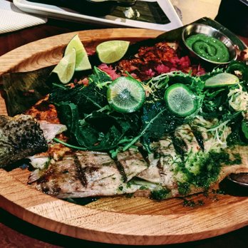 Leña Brava - Butterflied Baja Pacifico bass - 1/2 Tikin Xic (achiote, spices), 1/2 mojo verde (serrano, garlic, herby green). Epazote avocado. - Seafood Near Me - Chicago, Illinois