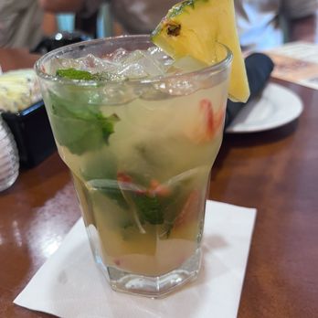 Cosmo's Restaurant & Bar - Mojito coconut and pineapple with strawberries - New American Near Me - Orange Beach, Alabama Cosmo's Restaurant & Bar - Mojito coconut and pineapple with strawberries - New American Near Me - Orange Beach, Alabama
