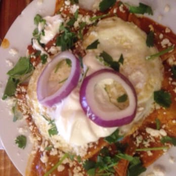 Park Cafe - Chilaquiles with sunny side up eggs , topped with red onions and sour cream . Sooo tasty and a good sized portion . - American Near Me - Litchfield Park, Arizona