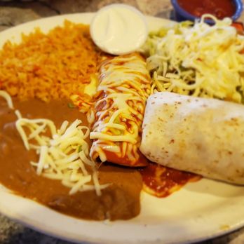 Casa Tequila Restaurant - Combination plate with Al pastor enchilada, carnitas burrito, ground beet tostada, sour cream, rice and beans - Mexican Near Me - Waukesha, Wisconsin