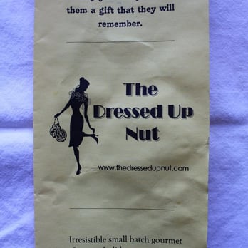 The Dressed Up Nut - a woman holding a tennis racket - Specialty Food Near Me - Arlington, Virginia The Dressed Up Nut - a woman holding a tennis racket - Specialty Food Near Me - Arlington, Virginia