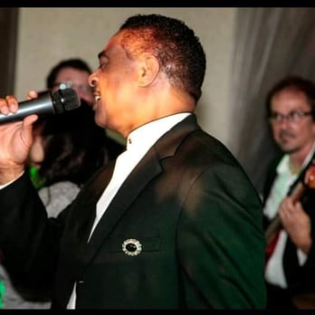 Encore Entertainment - a man in a tuxedo singing into a microphone - Jazz & Blues Near Me - Indianapolis, Indiana Encore Entertainment - a man in a tuxedo singing into a microphone - Jazz & Blues Near Me - Indianapolis, Indiana