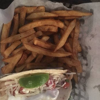 Blue Skye Brewery & Eats - Grilled fish tacos. Grilled fish with zesty pico cheese and sour cream. Seasoned fries on the side made it a very filling meal. - Pizza Near Me - Salina, Kansas