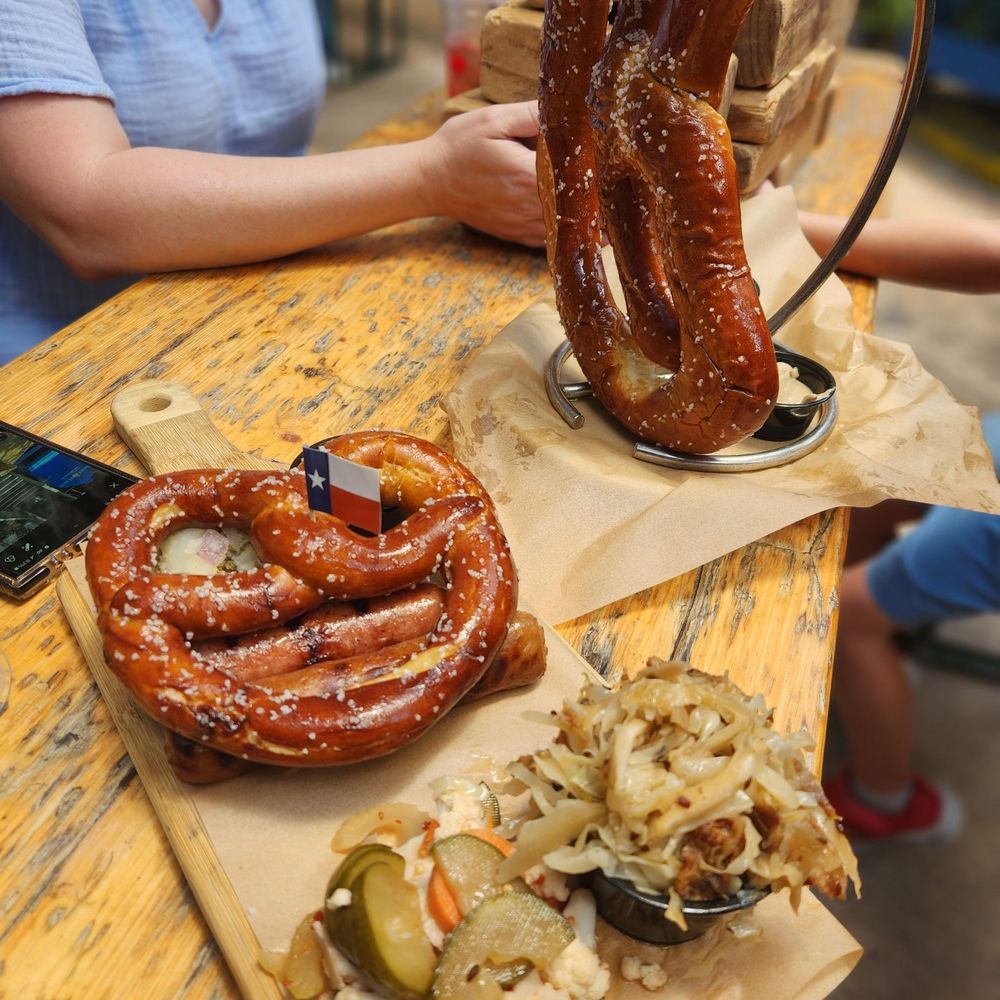Sausage paddle and one Bavarian pretzel Sausage paddle and one Bavarian pretzel