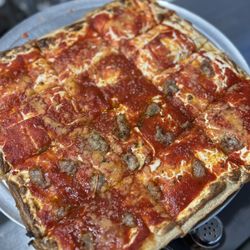 Prima Pizza - Upside down Sicilian with half sausage.