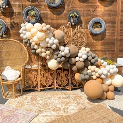 Sparkle & Bloom Events - Boho babyshower theme. We provided balloons, boho divider, rugs, and peacock chair!