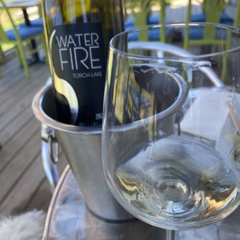 Waterfire Vineyards Torch Lake - Relaxing on the patio. Doggos welcome. - Wineries Near Me - Kewadin, Michigan Waterfire Vineyards Torch Lake - Relaxing on the patio. Doggos welcome. - Wineries Near Me - Kewadin, Michigan