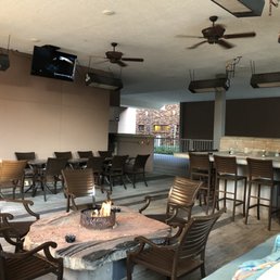 Outdoor lounge area with table top fire