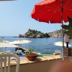 Pizzichella - The patio affords a great view of Isola Bella, and the rocky beach terrain.