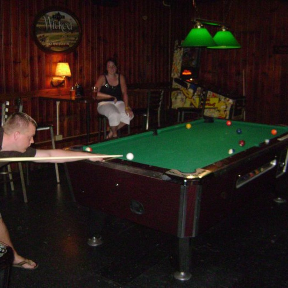 a man playing pool a man playing pool