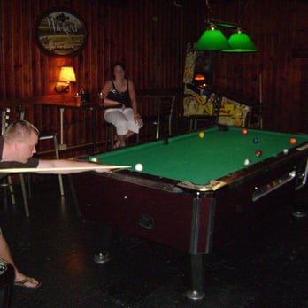 St James Tavern - a man playing pool - Pubs Near Me - Columbus, Ohio