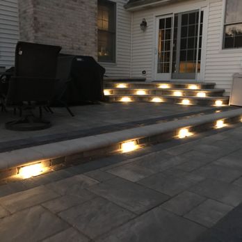 Creekside Outdoor Living - Ultimate backyard retreat complete with a pool, paver patio surround, gas fire pit, a stoop/stair/planter combo, and lots of lights. - Landscaping Near Me - Crown Point, Indiana Creekside Outdoor Living - Ultimate backyard retreat complete with a pool, paver patio surround, gas fire pit, a stoop/stair/planter combo, and lots of lights. - Landscaping Near Me - Crown Point, Indiana
