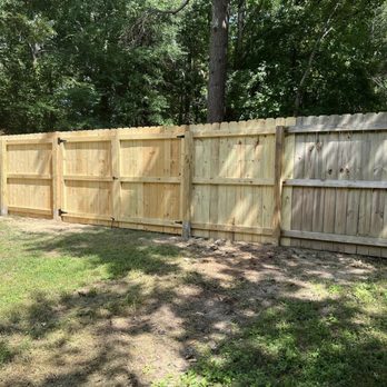 One Step Remodeling - a fence in a backyard - General Contractors Near Me