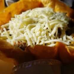 Gus' Pub And Pizzarama - Taco salad is large and loaded w/ground beef. Not at all spicy. Side of sour cream.