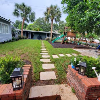 Paradise Yards & Design - Completed this beautiful home renovation in Seminole heights, Pavered area, Steps, Bordered play area, Rubber Mulch, Palms, Palms, Paradise - Tree Services Near Me Paradise Yards & Design - Completed this beautiful home renovation in Seminole heights, Pavered area, Steps, Bordered play area, Rubber Mulch, Palms, Palms, Paradise - Tree Services Near Me