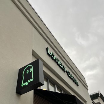 Ghost Grocery - a neon sign on the side of a building - Grocery Near Me - Provo, Utah