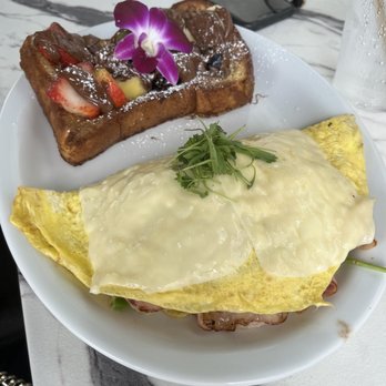 Bistro Cafe - Omelette with Nutella French toast. - Breakfast & Brunch Near Me - Miami, Florida Bistro Cafe - Omelette with Nutella French toast. - Breakfast & Brunch Near Me - Miami, Florida