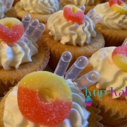 KupKake'd by DeVita - Peach flavored cupcake topped with mango butter cream and a shot of peach vodka.
