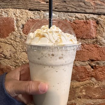 Timeless Cafe - a hand holding a cup of iced coffee - Cafes Near Me - Lebanon, Pennsylvania