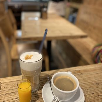 Cotidiano Gärtnerplatz - Ginger health shot, latte and cafe americano - Cafes Near Me - Munich, BY Cotidiano Gärtnerplatz - Ginger health shot, latte and cafe americano - Cafes Near Me - Munich, BY