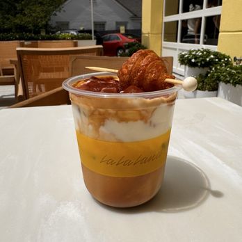 La La Land - Iced Espresso PSG Latte with mini croissant - Coffee & Tea Near Me - Austin, Texas La La Land - Iced Espresso PSG Latte with mini croissant - Coffee & Tea Near Me - Austin, Texas