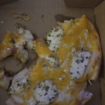 Pizza Shoppe - A mini pizza with two pieces missed and cheese for days. - Pizza Near Me - Shawnee, Kansas