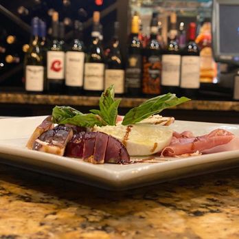 Brunello Italian Kitchen - Burrata Cheese, prosciutto Di Parma, Black mission Figs with a touch of edge balsamic and extra virgin olive oil - Italian Near Me - Deer Park, New York Brunello Italian Kitchen - Burrata Cheese, prosciutto Di Parma, Black mission Figs with a touch of edge balsamic and extra virgin olive oil - Italian Near Me - Deer Park, New York
