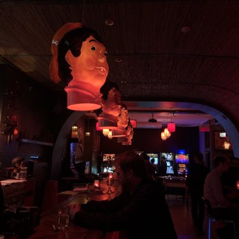 Lucky Hô - people sitting at a bar in a dimly lit room - Bars Near Me - Montreal, Quebec Lucky Hô - people sitting at a bar in a dimly lit room - Bars Near Me - Montreal, Quebec