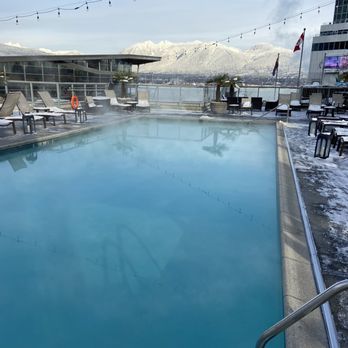 Fairmont Waterfront - The heated pool overlooking the harbour.  Not warm but pleasant enough to swim in one of Vancouver's rare snowfalls. - Hotels Near Me - Vancouver, British Columbia