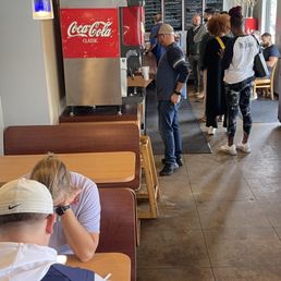 a group of people in a restaurant a group of people in a restaurant