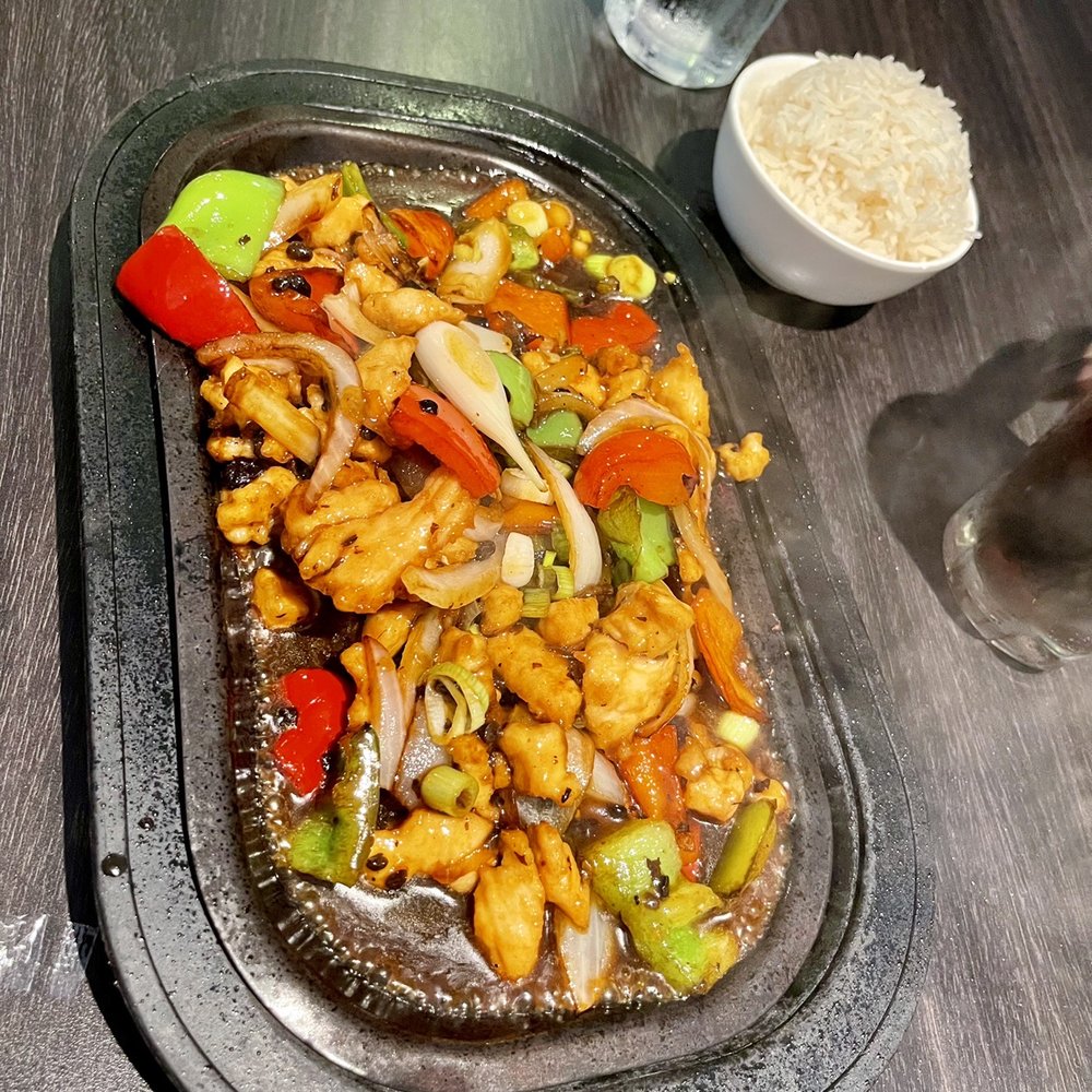 Bo Lings - Sizzling Cantonese Chicken (comes with a side of rice) - Chinese Near Me - Overland Park, Kansas Bo Lings - Sizzling Cantonese Chicken (comes with a side of rice) - Chinese Near Me - Overland Park, Kansas