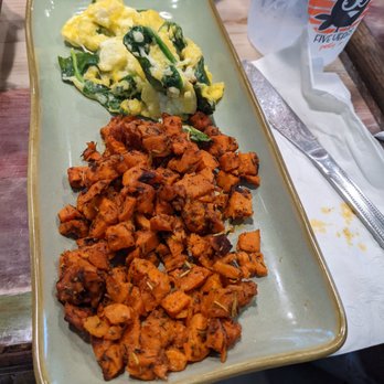 What's Crackin Cafe - Parm Spinach Scramble with al dente seasoned sweet potatoes. - Breakfast & Brunch Near Me - Mesa, Arizona What's Crackin Cafe - Parm Spinach Scramble with al dente seasoned sweet potatoes. - Breakfast & Brunch Near Me - Mesa, Arizona