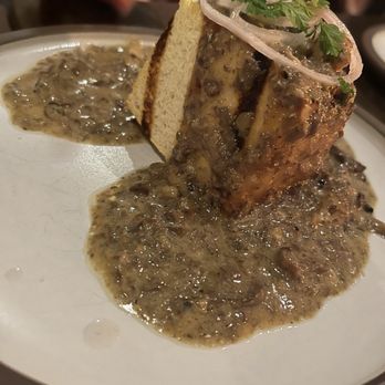 Dovetail - a piece of meat and gravy on a plate - American Near Me - Vancouver, British Columbia Dovetail - a piece of meat and gravy on a plate - American Near Me - Vancouver, British Columbia