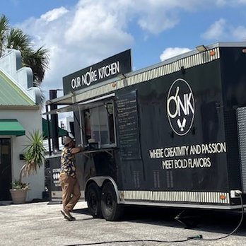 Our Noire Kitchen - the truck, parked on Fl Ave. - Caterers Near Me - Lakeland, Florida