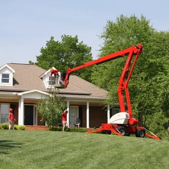 Celtic Tree & Landscape - a man on a cherry picker - Tree Services Near Me