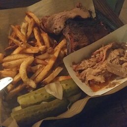 Photo of Capitalist Pig - Saint Louis, MO, United States. brisket, ribs, and pulled pork with fries and pickles