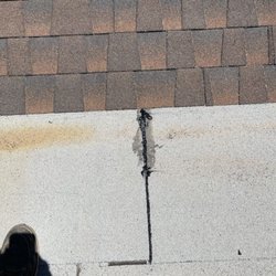 Cardinal Roofing - Time and heat caused a small separation between the actual roof and flat torch down. The flat was not installed by Cardinal Roofing but fixe