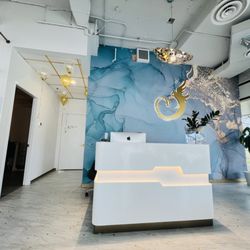 Anka Pilates & Rehabilitation Centre - Reception desk and waiting area with confortable seating.
