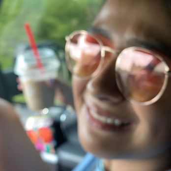 Tim Hortons - a woman in a car holding a cell phone - Bakeries Near Me - Brantford, Ontario Tim Hortons - a woman in a car holding a cell phone - Bakeries Near Me - Brantford, Ontario