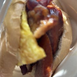 Sausage eggs bacon and cheese bagel