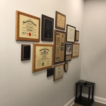 Upper Cervical Specialists - Diplomas, articles and plaques around the wall. - Chiropractors Near Me - Atlanta, Georgia