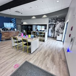 OceanAir Federal Credit Union - Entrance Right side: Office spaces , tables chairs and front desk
