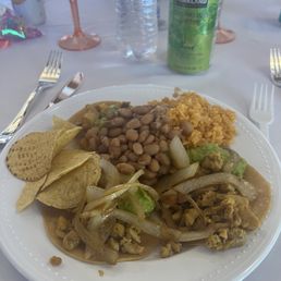 Chicken tacos, beans, rice, and guacamole