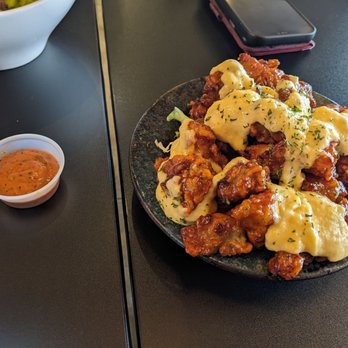 Rice Junky - CC chicken starter with melted cheddar and angry sauce on the side - Pubs Near Me - Santa Clara, California