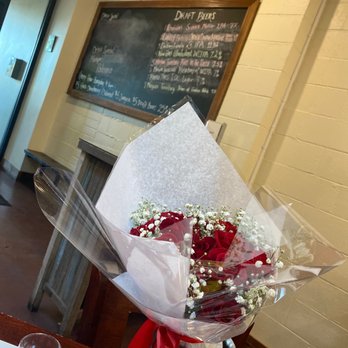 Bistro 135 - a bouquet of roses and baby's breath - Italian Near Me - Tracy, California