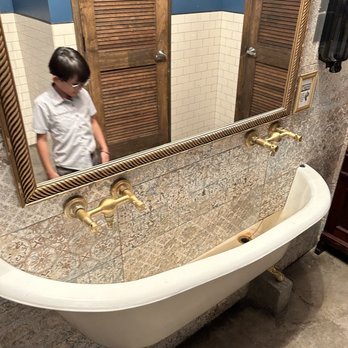 Bunbury - Love the sink in the bathroom. Bathtub shared each side by men's bathroom and women's bathroom. - Argentine Near Me - Miami, Florida