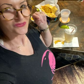 La Cantina - a woman sitting at a table with food - Tex-Mex Near Me - Vail, Colorado