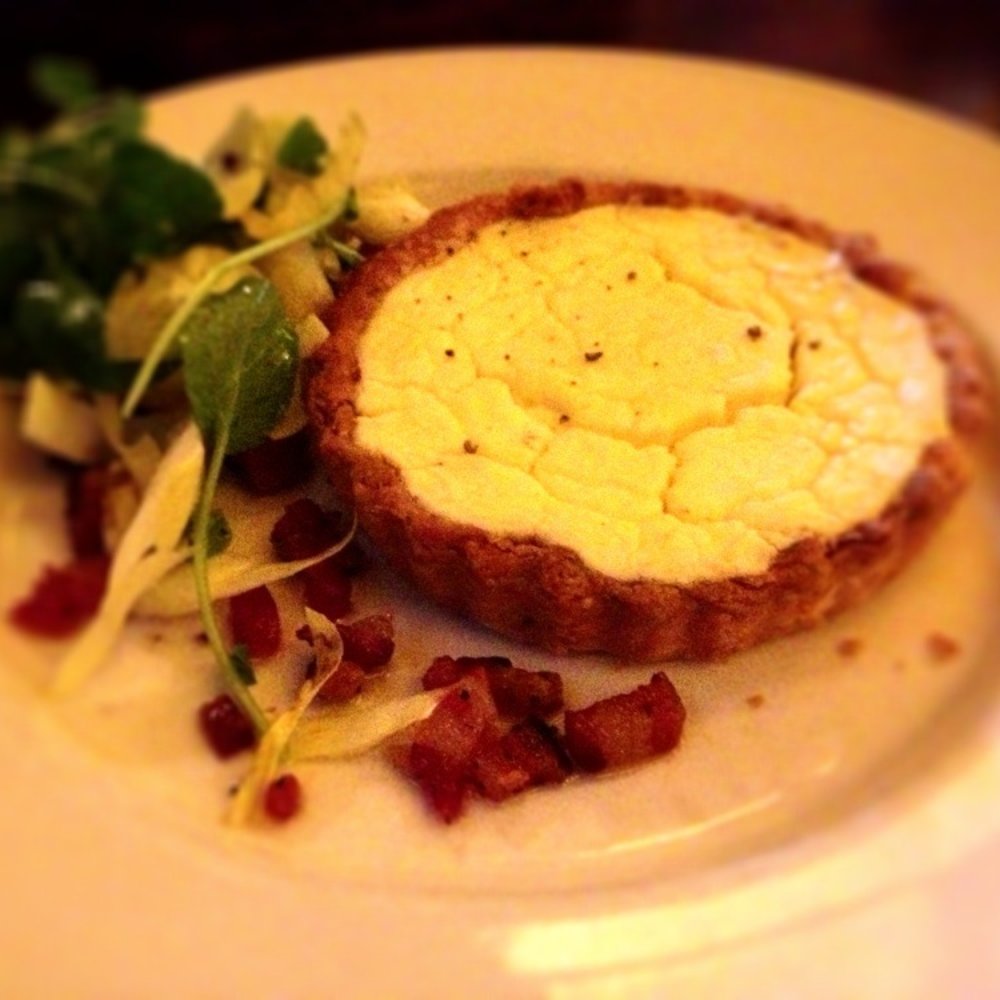 Warm goat cheese tart with Caramelized onions, pancetta and watercress salad Warm goat cheese tart with Caramelized onions, pancetta and watercress salad
