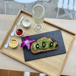 Avotoasty - Bougie Toasty - avotoast, hackleback caviar, 24k gold flake, chives, egg yolk, crème fraîche, sweet hot pepper, complimentary sparkling wine