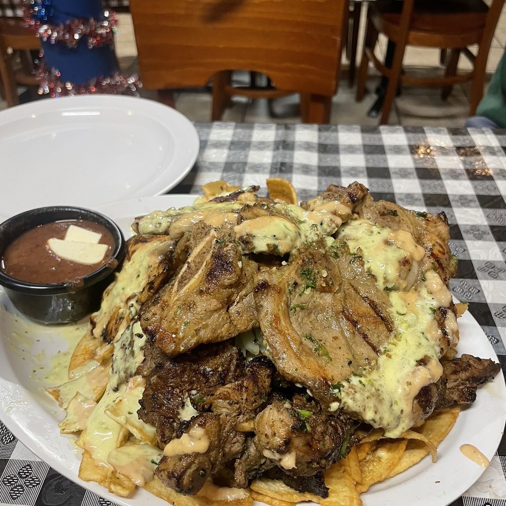 Honduras Grill - a plate of food on a table - Honduran Near Me - Los Angeles, California Honduras Grill - a plate of food on a table - Honduran Near Me - Los Angeles, California